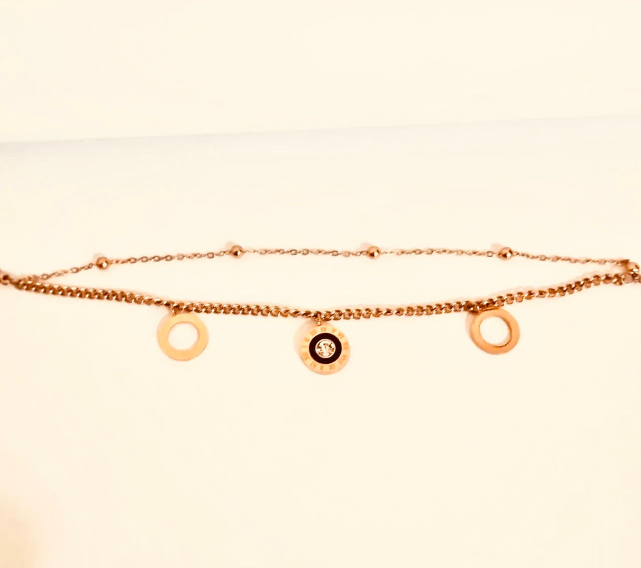 Elegant Gold-Tone Charm Bracelet with Roman Numeral Charm